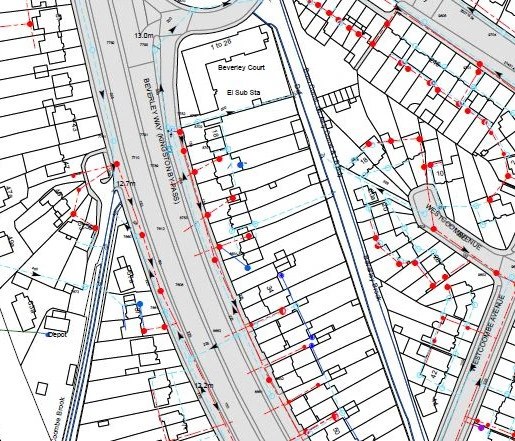 A utility plan drawing with services traced in red and blue over an Ordnance Survey base